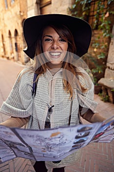 Touristâ€™s girl with map on the journey