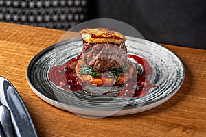 Tournedos Rossini with foie-gras. Fillet mignon steak Serving in the restauran