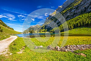 Tourquise clear Seealpsee with the Swiss Alps, Appenzeller Land, Switzerland photo