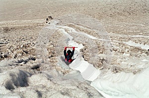 Toursits sliding on Volcano, Chile