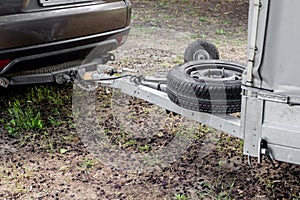 Tow hitch on a car. Trailer drawbar with spare wheel