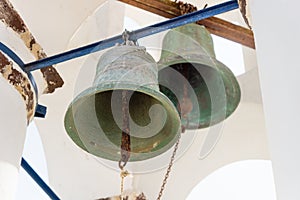 Tow old bells in a Greek church tower in Oia, Santorini, Greece