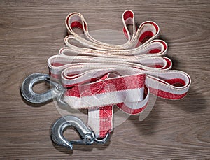 Tow rope for a car on wood background.
