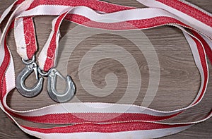 Tow rope for a car on wood background.