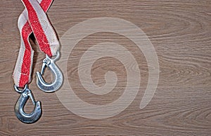 Tow rope for a car on wood background.