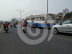 Tow truck delivers the damaged BMTC Bus, Repair and recovery vehicle towing a broken city bus