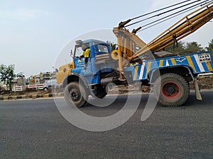 Tow truck delivers the damaged BMTC Bus, Repair and recovery vehicle towing a broken city bus