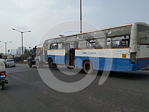 Tow truck delivers the damaged BMTC Bus, Repair and recovery vehicle towing a broken city bus