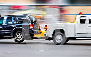 Tow truck delivers the damaged vehicle