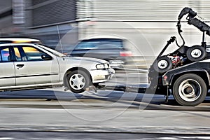 Tow truck delivers the damaged vehicle