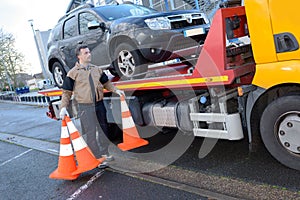 Tow truck takes away broken car