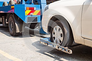 Tow truck towing a broken down car