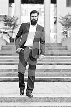 Toward business achievements. Conquer business world. Office worker confidently step on stairs. Bearded man going to