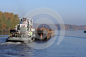 Towboat and barge in river