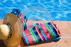 Towel and bathing accessories near pool