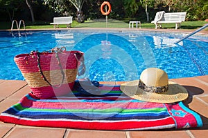 Towel and bathing accessories near pool