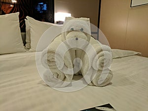 Towel bear origami on cruise ship bed