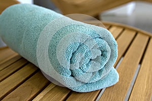 Towel braided in a tubule on chair