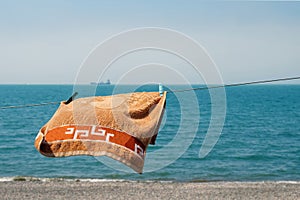 Towel hanging on the rope on the beach