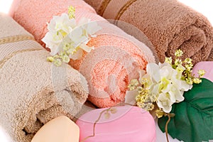 Towel, soaps and flowers