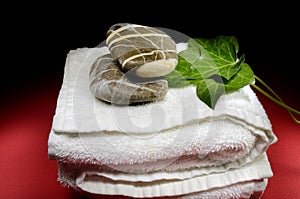 Towel, stones and ivy leaves