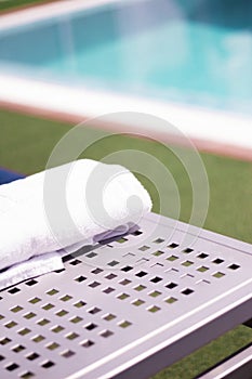 Towel on table in the pool of a luxury hotel