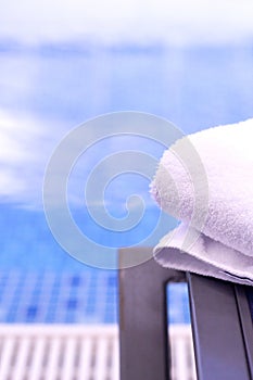 Towel on table in the pool of a luxury hotel