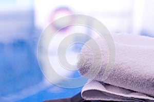 Towel on table in the pool of a luxury hotel