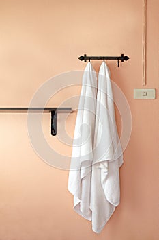 Towel, a towel hangs on an orange wall selective focus