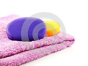 Towels with colorful pieces of soap