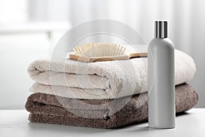 Towels with hair brush and shampoo