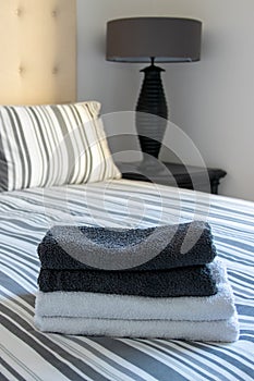 towels laid on a bed in a hotel room