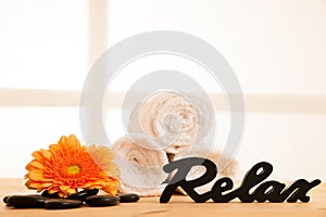 Towels and masage rocks on table in spa salon photo