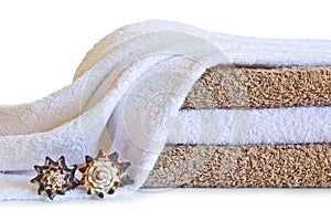 Towels with shells isolated on a white background