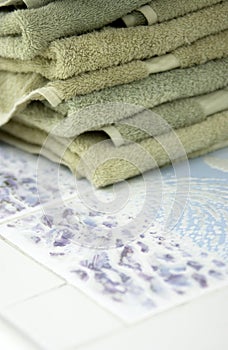 Towels sitting on poolside table