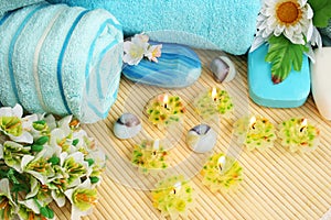 Towels, soaps, flowers, candles