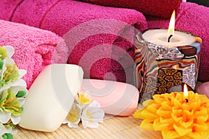 Towels, soaps, flowers, candles