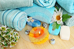 Towels, soaps, flowers, candles