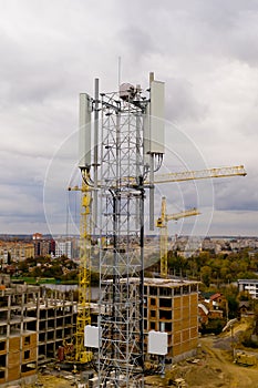 Tower with 5G and 4G cellular network antenna. Aerial view