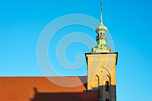Tower against a blue sky with clouds in Gdansk, Poland.