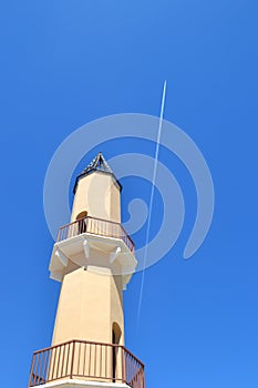 Tower Against Clear Blue Sky with Vapour Trail, Fuengirola, Spain.
