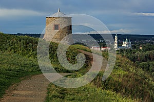 Tower of ancient Bulgar fortress on a high cliff on the banks of the Kama River photo