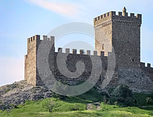 Tower and Ancient Fortress Wall with Loopholes and Fortifications