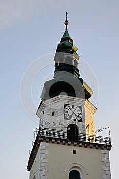 Tower of baroque Church Of Saint Jacob, also called Franciscan church, sunlit by winter daylight sunshine.