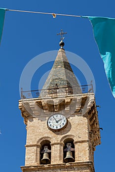 The tower bells and big clock of Saint Santiago church in Villena city, Alicante, Spain