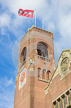 Tower of the Berlage building and flag in Amsterdam