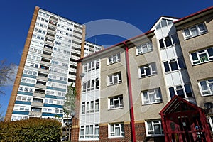 A tower block and apartment building owned by the local authority situated on the English Council housing estate