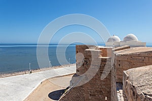 Tower of the Borj el Kebir Castle with background of Mediterranean sea in Houmt El Souk in Djerba, Tunisia photo