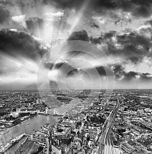 Tower Bridge and city skyline along river Thames at night, aerial view - London - UK