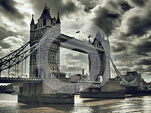 Tower Bridge is a drawbridge in London over the River Thames. Next to it is the Tower of London, after which the bridge was named